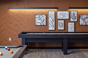 Richfield apartment for rent - a game room with a pool table and artwork on the wall