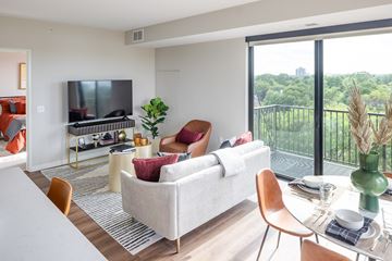 Richfield apartment for rent - a living room with a couch and a table and a television