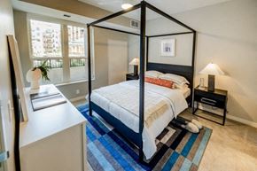 Minnetonka apartment for rent - a bedroom with a bed and a large window