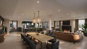Plymouth apartment for rent - A modern dining room with a fireplace and a large wooden table.