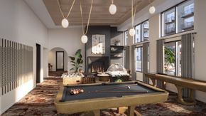 Plymouth apartment for rent - A pool table is in the middle of a room with a fireplace and a balcony.