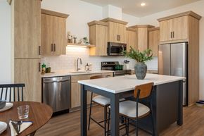 Minnetrista apartment for rent - Open kitchen with wood grain cabinets and a large center island