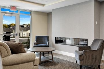 Victoria apartment for rent - a living room with couches and chairs and a fireplace