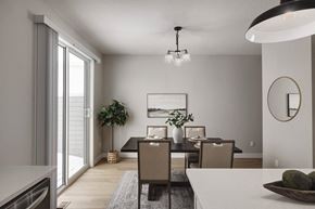 Mound townhouse for rent - A modern dining room with a large table and chairs.