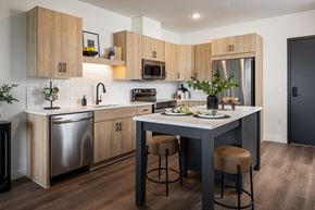Minnetonka apartment for rent - A modern kitchen with wooden cabinets and stainless steel appliances.