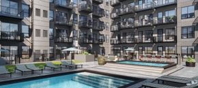 Minneapolis apartment for rent - an image of an apartment complex with a pool and hot tub