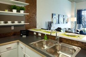 Grand Rapids apartment for rent - A kitchen with a sink and a counter with a sign that says "House Opens".