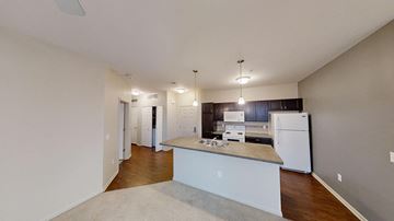 Auburn Hills apartment for rent - a kitchen with a counter top and a refrigerator