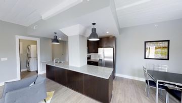 Grand Rapids apartment for rent - a kitchen and living room with a table and chairs