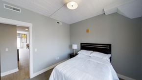 Grand Rapids apartment for rent - a bedroom with a bed and a door to a bathroom