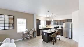 Holt apartment for rent - a kitchen with stainless steel appliances and a counter top