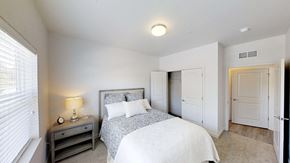 Holt apartment for rent - a bedroom with a bed and a closet