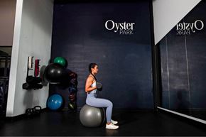 Mount Pleasant apartment for rent - A woman is sitting on a fitness ball in a gym.