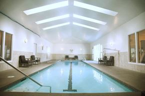 Spokane apartment for rent - A large indoor swimming pool with a skylight above it at Graymayre Crossing Apartments, Spokane, WA, 99208