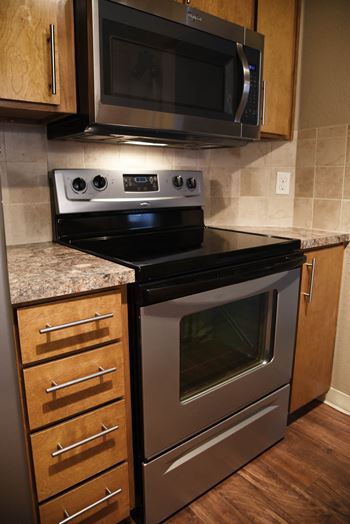 Black appliances with cabinets