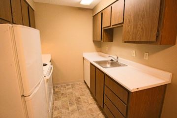 Spokane apartment for rent - a kitchen with a sink and a refrigerator