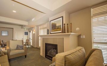 Coeur D Alene apartment for rent - A living room with a fireplace and a painting on the wall.