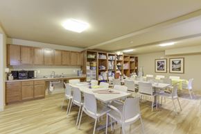 Kennewick apartment for rent - A kitchen with a dining table and chairs.