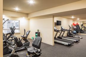 Ramsey apartment for rent - A gym with treadmills, exercise bikes, and other equipment.