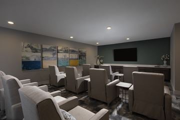 Fort Worth apartment for rent - A living room with a grey couch and a painting on the wall.