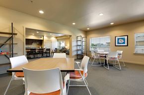 Round Rock apartment for rent - A conference room with a long table and chairs.