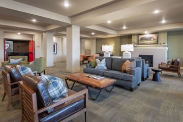 Eagan apartment for rent - A living room with a fireplace and a couch.