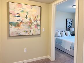 Walla Walla apartment for rent - A painting hangs on a wall above a bed in a bedroom.