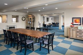 Loveland apartment for rent - A dining room with a wooden table and chairs.