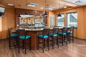 Arlington apartment for rent - A kitchen with a bar area featuring a counter and chairs.