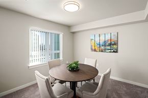 Arlington apartment for rent - A dining room with a round table and chairs.