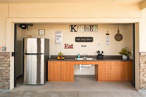 Aurora apartment for rent - A kitchen with a refrigerator and a sink.