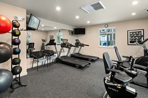 Spokane Valley apartment for rent - A gym with treadmills, exercise balls, and weights.