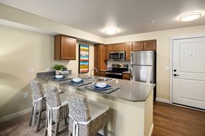 Puyallup apartment for rent - A kitchen with a table and chairs.