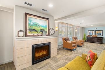Austin apartment for rent - A living room with a fireplace and a painting on the wall.