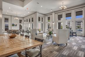 Cedar Park apartment for rent - A large dining room with a wooden table and chairs.