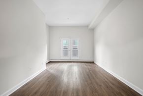 Halifax apartment for rent - an empty living room with white walls and wood floors