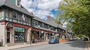 Halifax apartment for rent - A street view of a small town with a car parked on the side of the road.