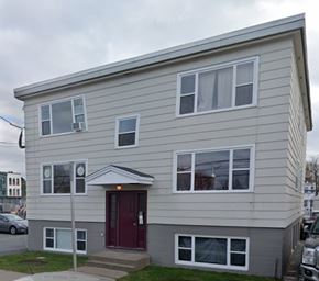 Halifax apartment for rent - A two-story house with a red door and white trim.