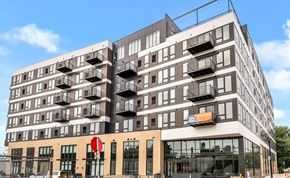 Minneapolis apartment for rent - a large apartment building with balconies on the side of it