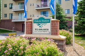 Burnsville apartment for rent - an image of the station sign in front of an apartment building
