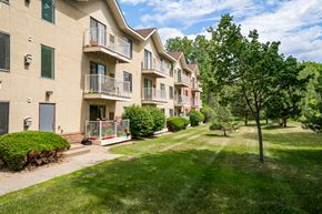 Burnsville apartment for rent - our apartments are located in a quiet neighborhood with green grass and trees
