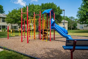 Burnsville townhouse for rent - a playground at a park with a blue slide