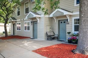Burnsville townhouse for rent - a front porch with a bench in front of a house