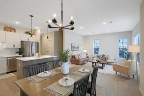 Medina townhouse for rent - A modern dining room with a wooden table set for two.