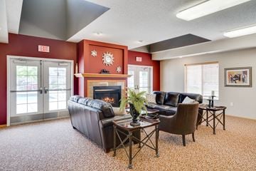 Eagan townhouse for rent - a living room with leather furniture and a fireplace
