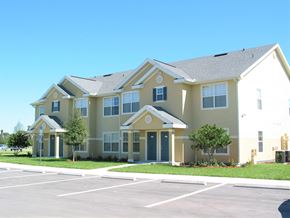 Ruskin apartment for rent - a large building with a parking lot in front of it