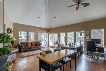San Antonio apartment for rent - A living room with a brown couch and a wooden table.