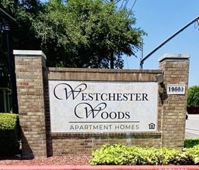 Pflugerville apartment for rent - a sign apartment homes in front of a brick wall