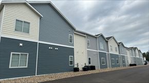 Windom apartment for rent - a row of houses with blue vinyl siding