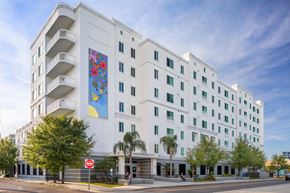 Tampa apartment for rent - a large white building with a mural on the side of it